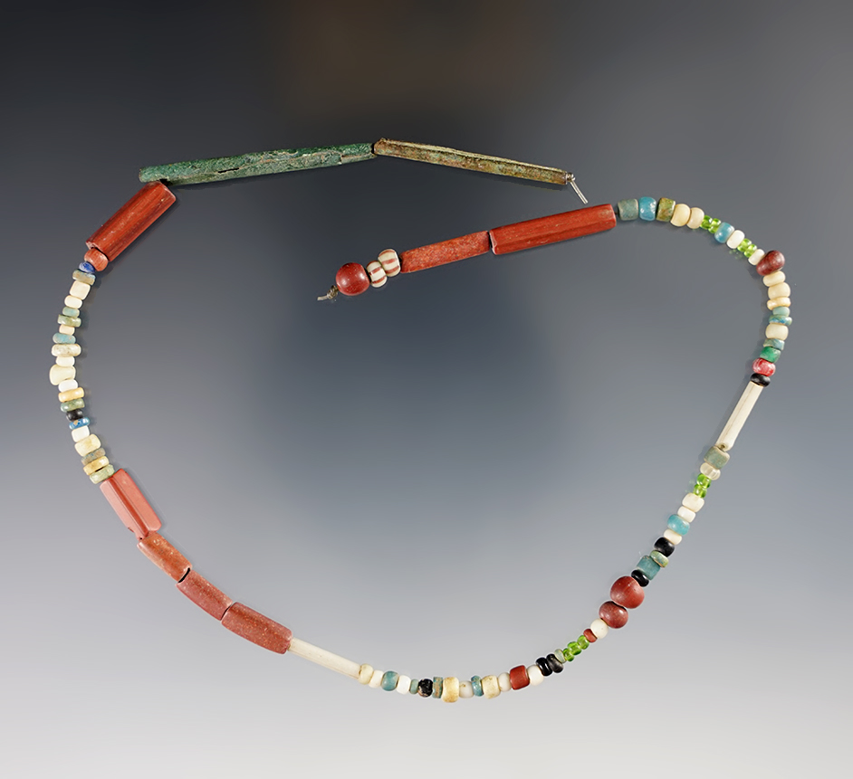 13 1/2" Strand of small Catlinite, Seed, Ground and Tubular Beads found in Lima, New York.