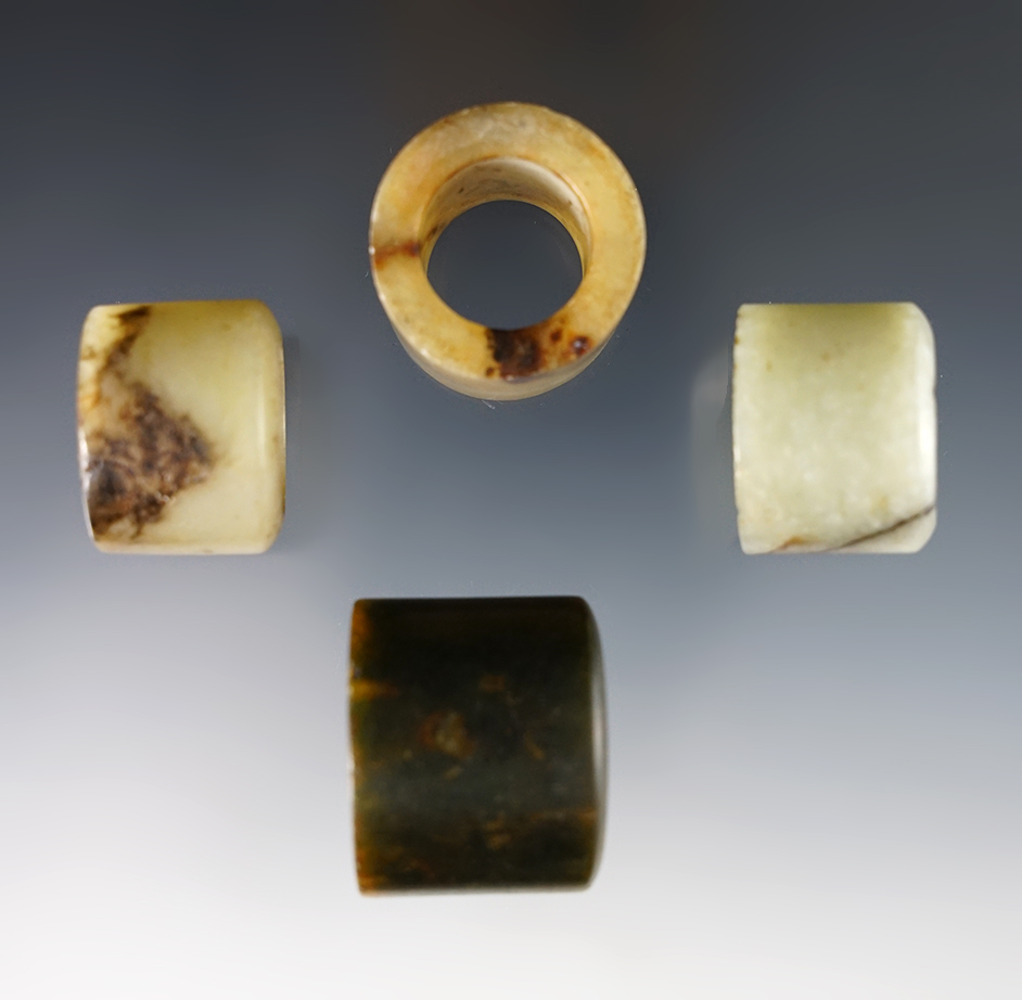 Set of 4 vintage Chinese Jade Rings. Exact age unknown. The largest is 1 1/8".