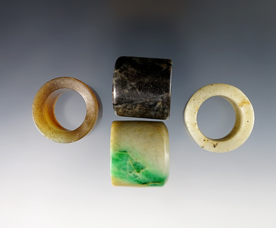 Set of 4 vintage Chinese Jade Rings. Exact age unknown. The largest is 1 1/16".