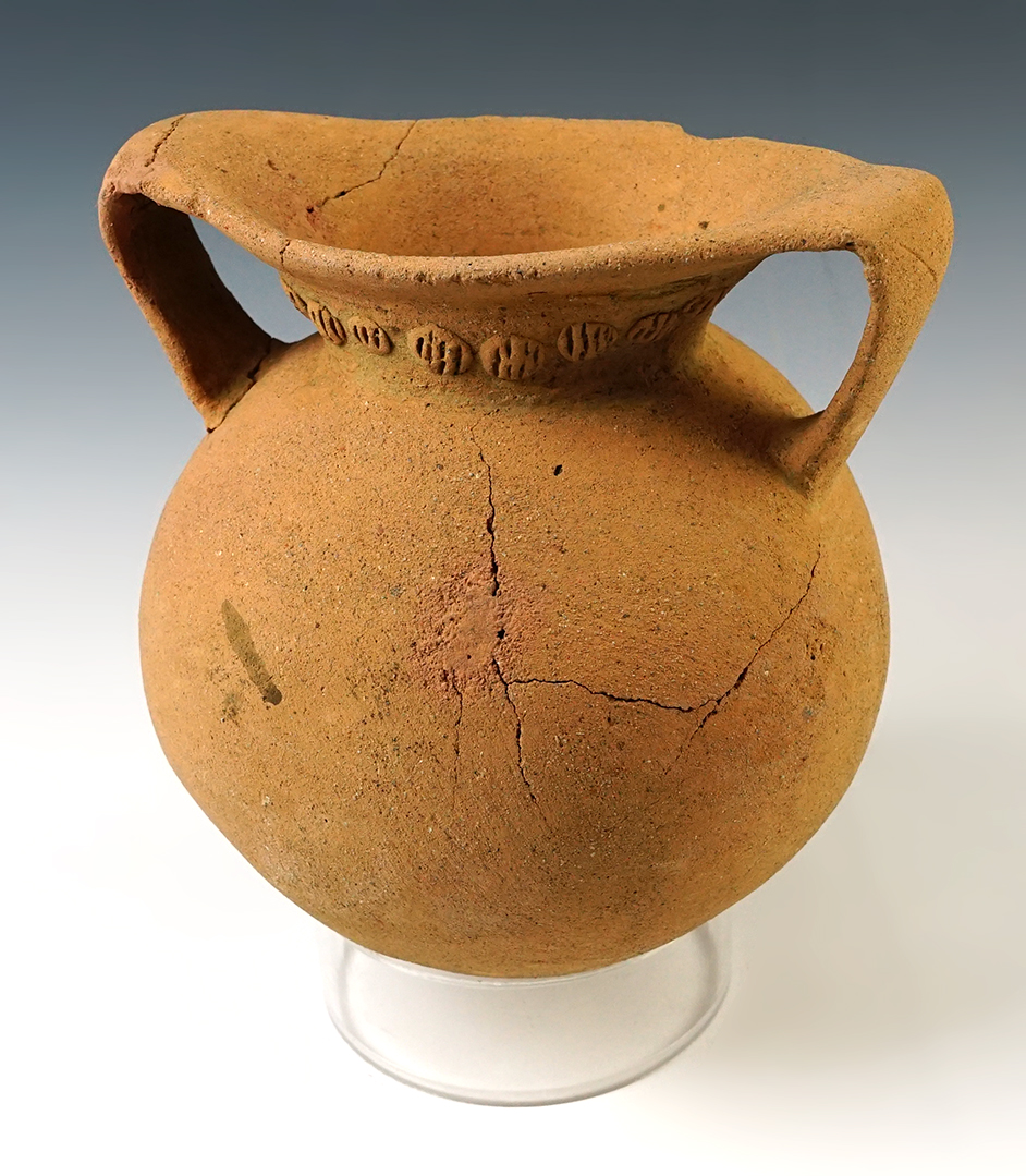 6 1/2" tall by 5 3/4" wide ancient pottery vessel with several reattached pieces, but no filler. 