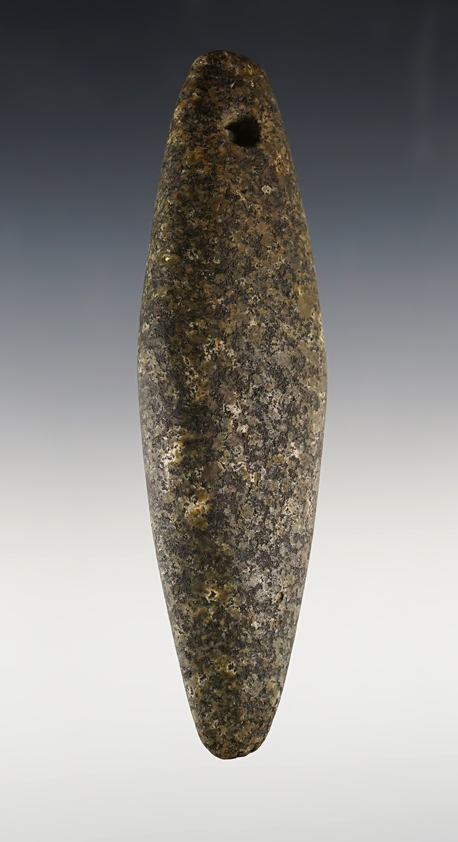 5 1/8” x 1 7/16" perforated Charmstone made from beautiful Porphyritic Granite. California. 