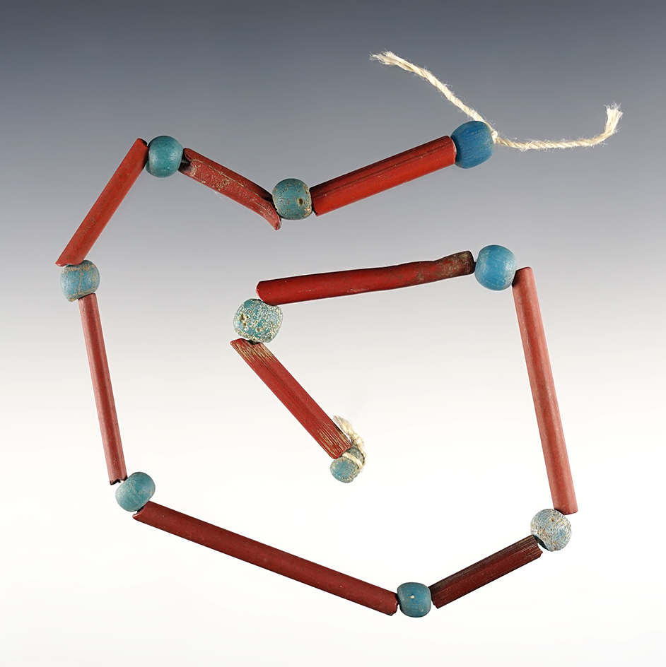 12" strand of longer red straws and "Dutch" blue beads recovered at the Dann Site, New York.