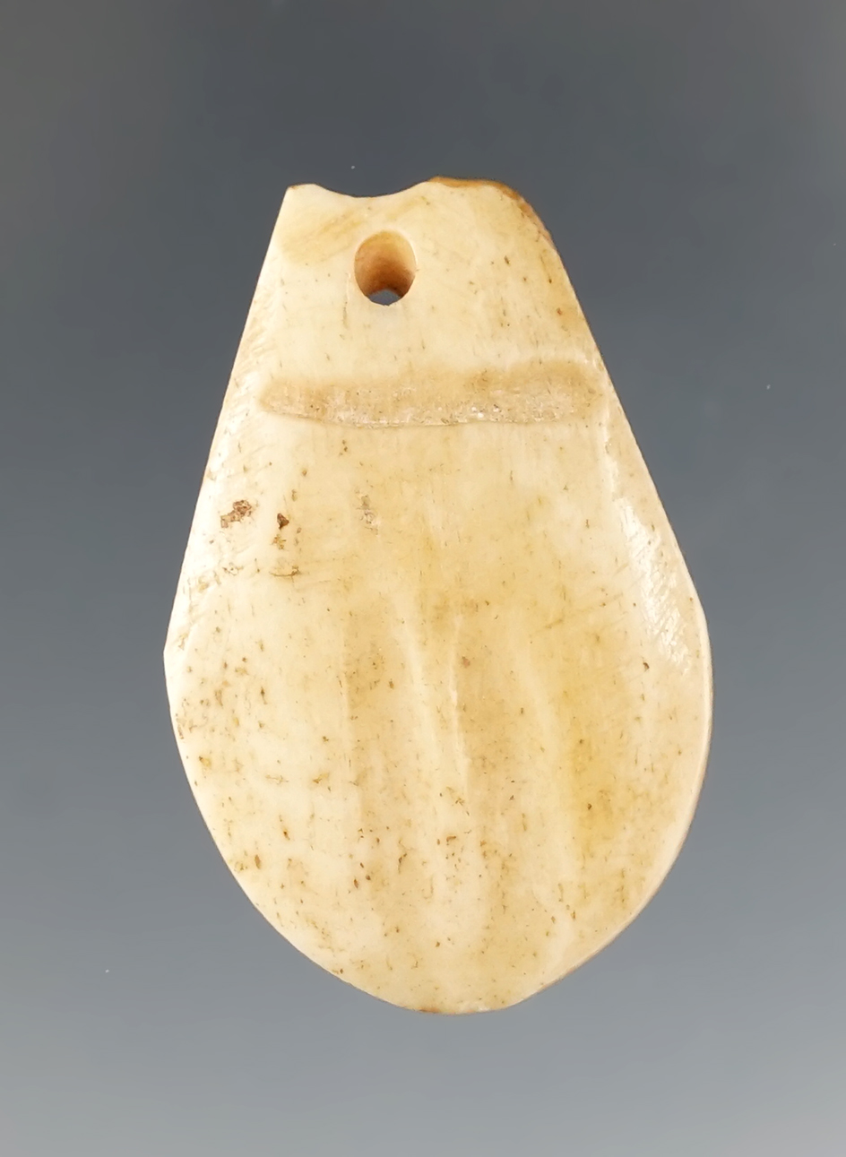 1 1/2" Drilled Pendant made from Bone, found in Alaska. Comes with a Bennett COA.