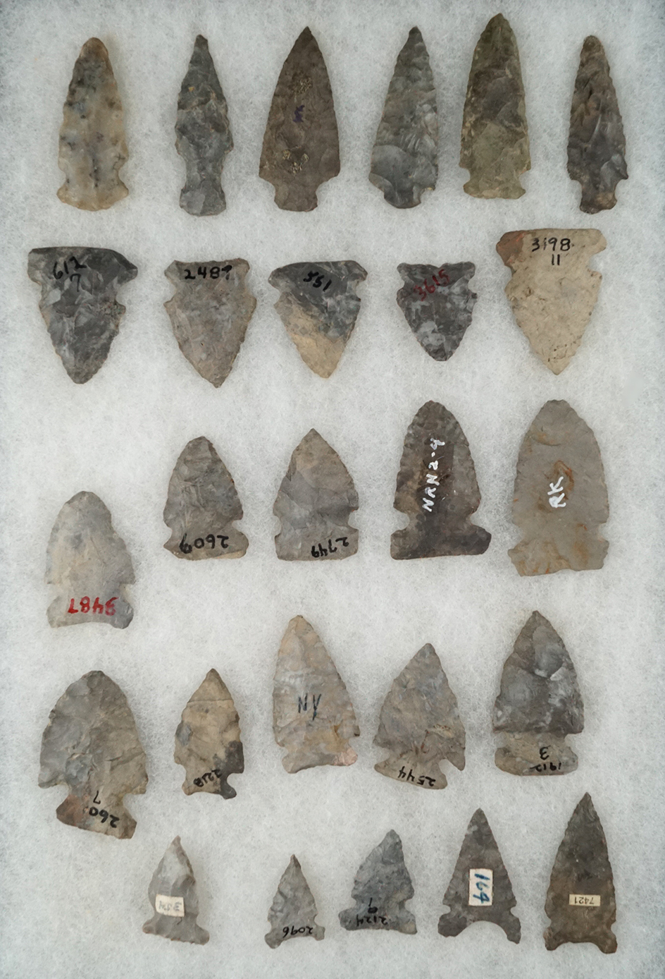 Group of 26 assorted New York arrowheads, a few have minor restoration. Largest is 2 3/16".