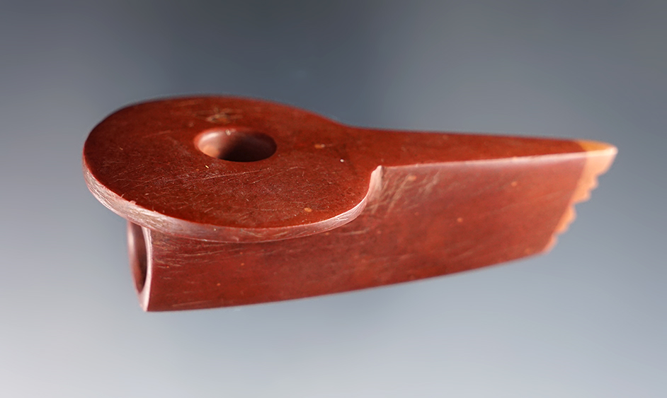 3 5/16" Catlinite Disc Pipe found in Michigan. Fringed stem and zig zag incised line design.