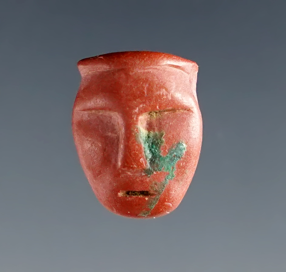 Rare 5/8" Catlinite Maskette Bead that is drilled for suspension.  New York. Circa 1710-1745.