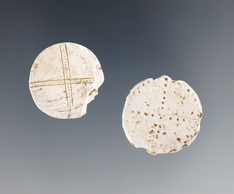 Pair of Shell Runtees with incised design of cross lines with dots. Great Gully Site, New York. 