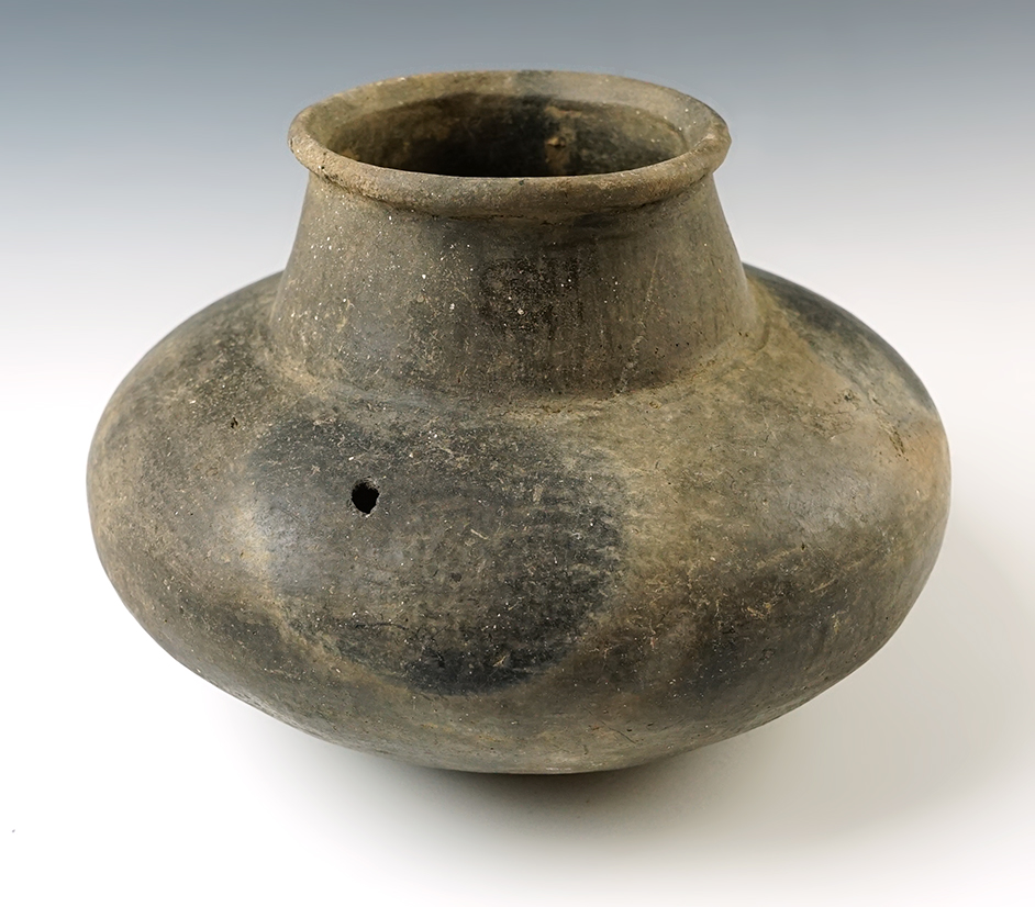 6 3/4" x 4 3/4" pottery vessel with a couple small probe holes, 3 small reattached fragments.
