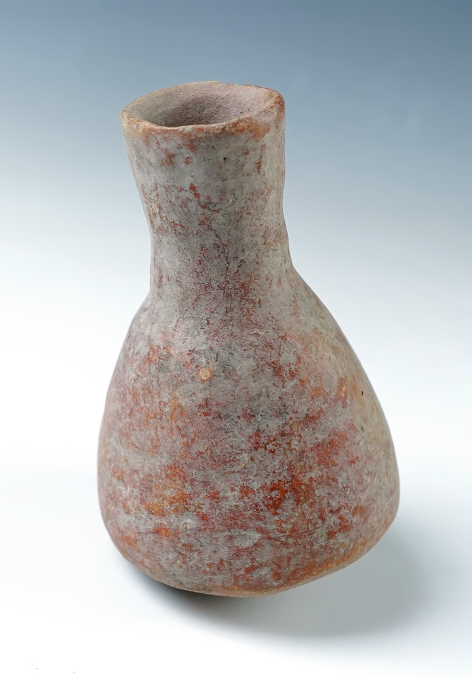 4" tall Pottery Bottle that is heavily patinated from the Mediterranean. 