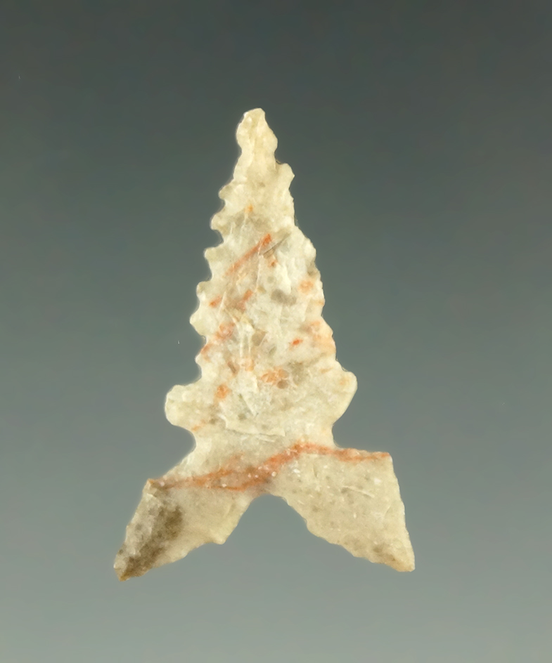 1" nicely serrated  Toyah point found in Texas. Ex. Charles Shewey collection.