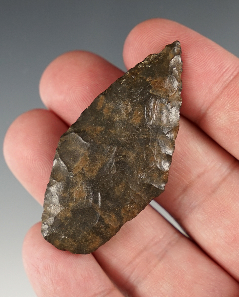 2 3/16" Stemmed Knife that is heavily patinated with grinding to the stem sides and bottom of base.