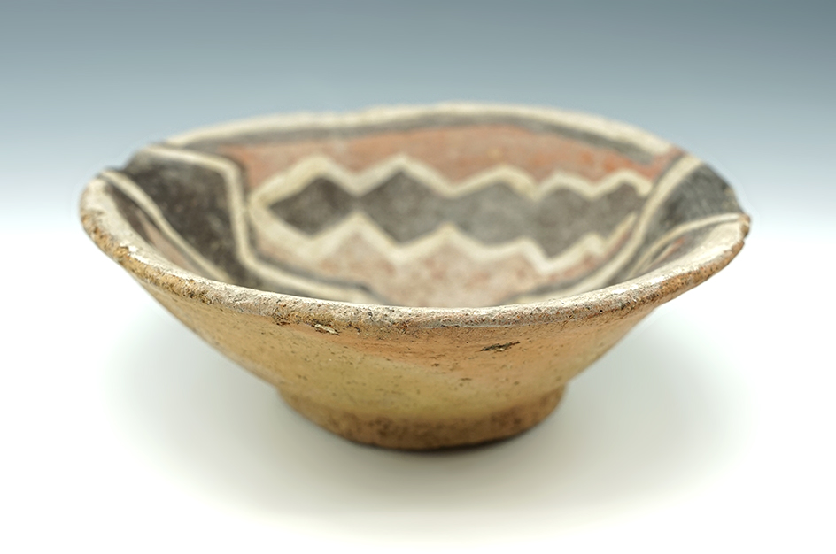 Nice interior paint design on this 5 3/8" diameter Chancay Culture pottery bowl found in Peru.