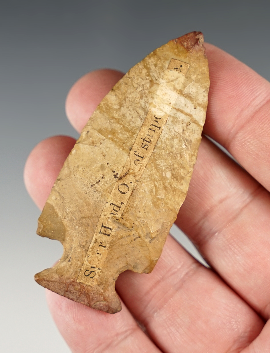 2 3/4" heavily patinated Ohio Tablerock point that is well made. Comes with an early collectors card