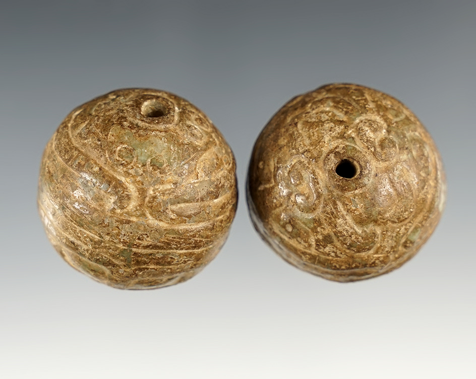 Beautifully carved pair of PreColumbian Beads. The largest is 1 3/8".