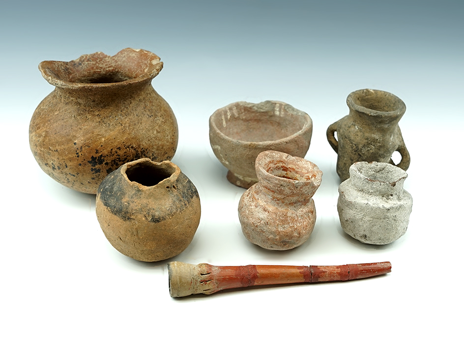 Set of 6 Miniature Pre-Columbian pottery vessels and a repaired pipe. Largest vessel is 4 1/4" wide.
