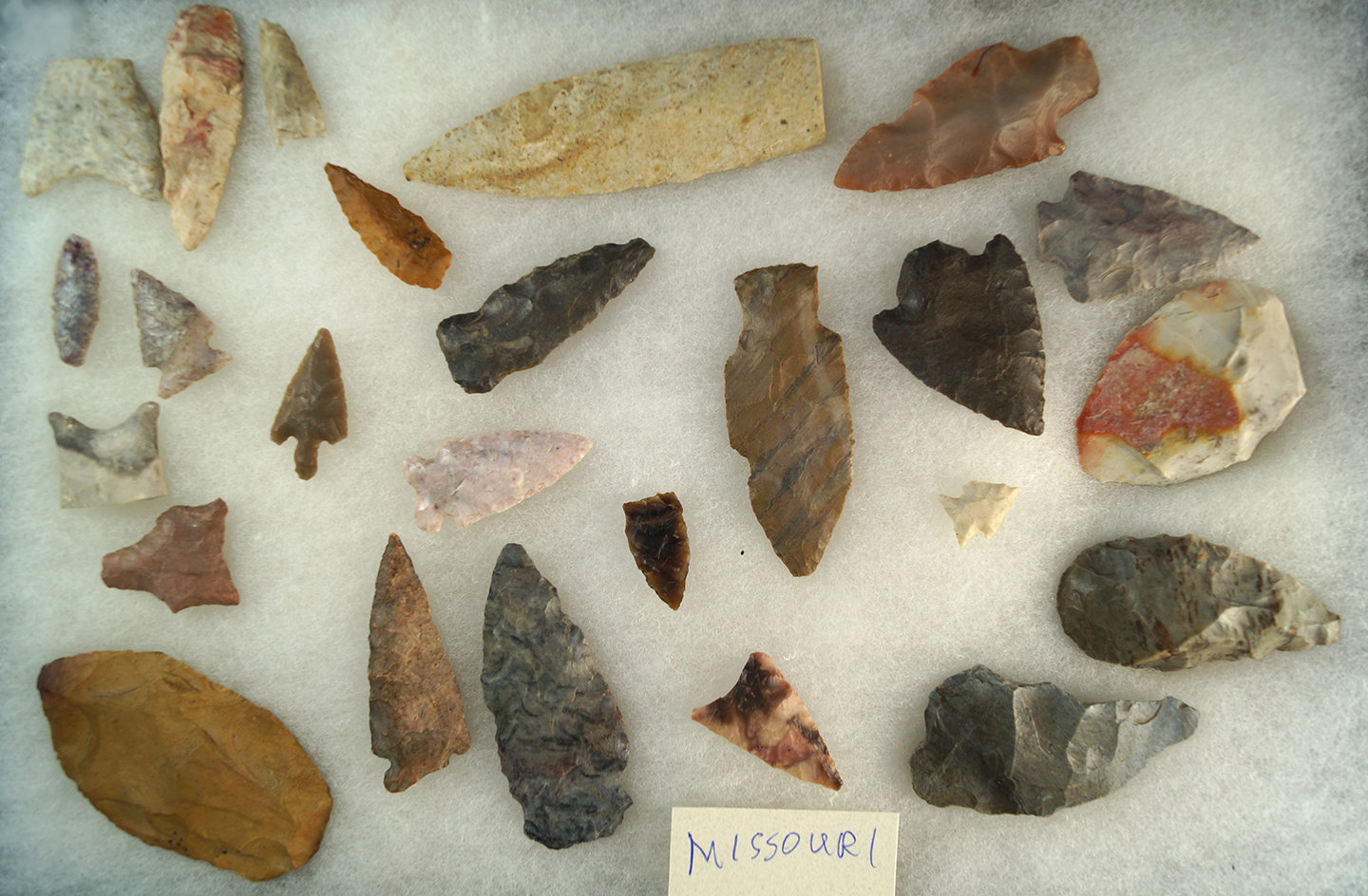 Group of assorted artifacts including a paleo base found in Yavapai County Arizona. Some damaged.