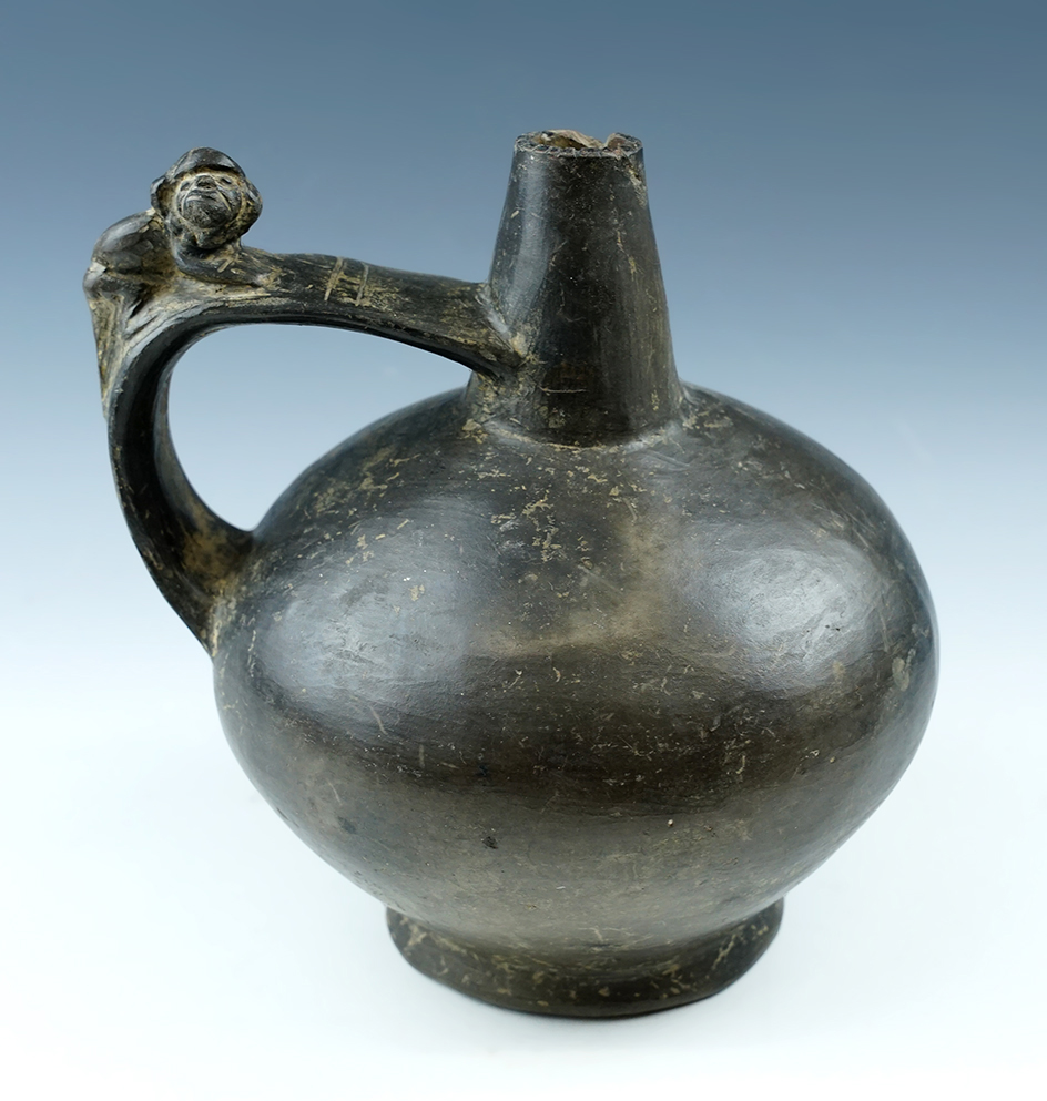 6" Wide x 7" Tall Sican Strap Handle Bottle with a monkey effigy, found in Peru.