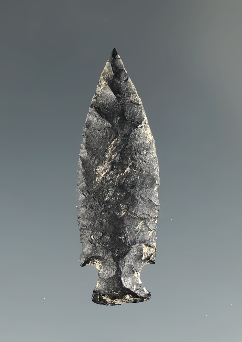 Exceptional flaking and style on this very thin 1 3/16" Dagger point found near the Columbia River.