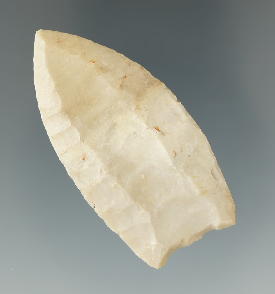 2 1/8" Folsom found in Lee Co., Texas on the Fold Sand Site. Restoration to the top half.