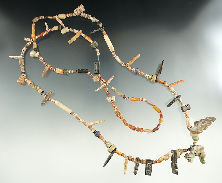 38" Strand Peruvian necklace featuring many drilled fetish pendants. Recovered in Cusco, Peru.