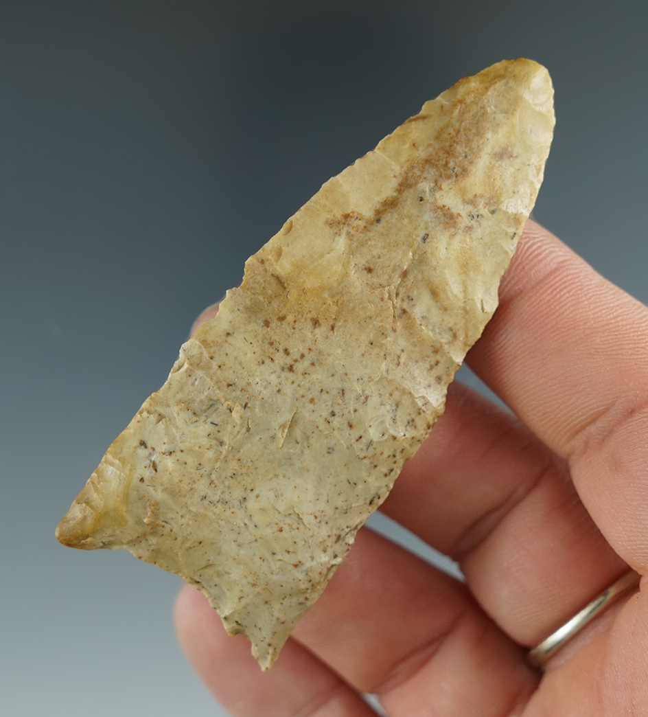 2 3/4" Clovis made from tan Chert, found in Indiana. Comes with a Davis COA.