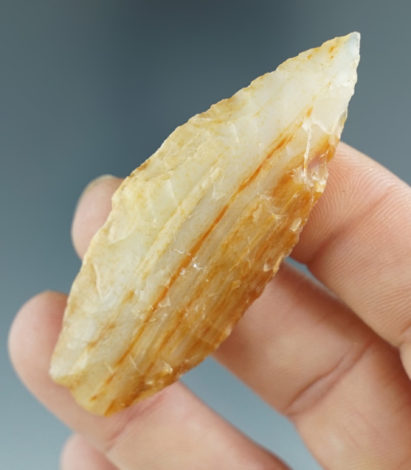 Semi-translucent 2 1/2" Agatized Wood Cascade with nicely ground lower edges. Washington.