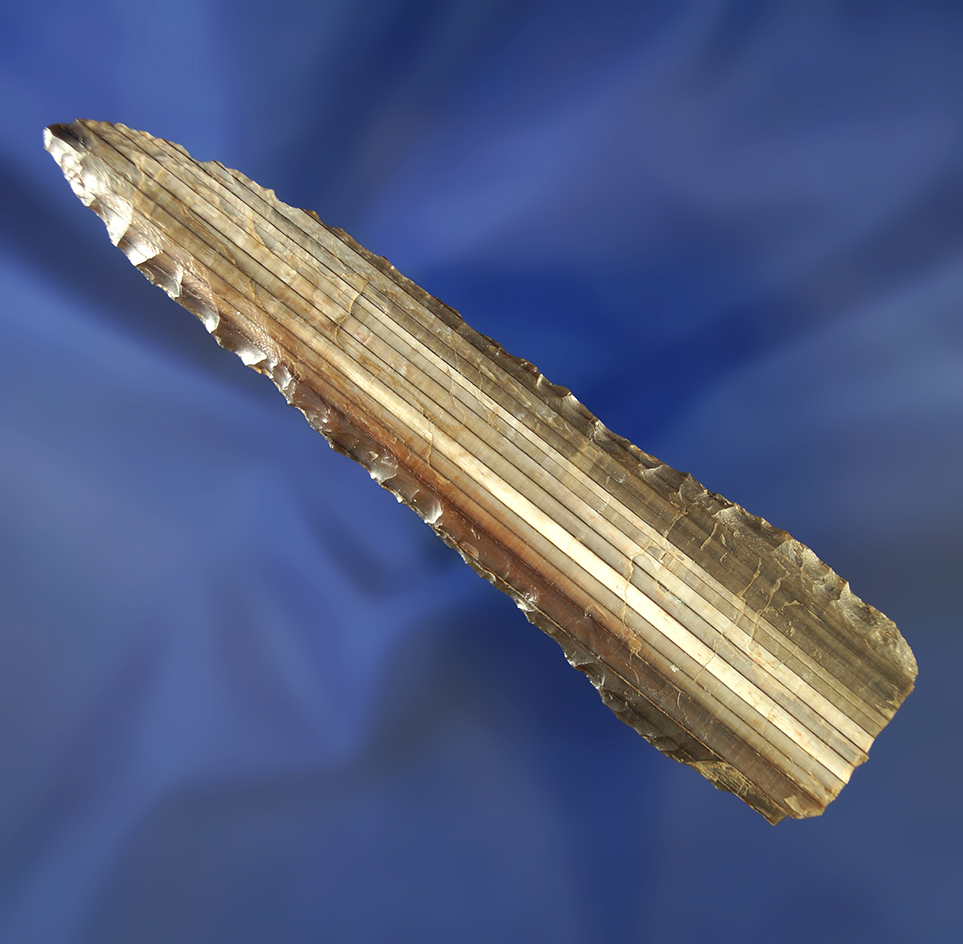 Beautifully banded 4 1/16" petrified wood knife. Basal area has been snapped which is common