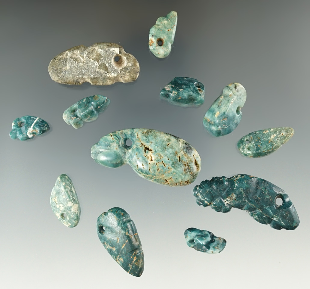 Set of 12 pre-Columbian beads and effigy pendant found in Mesoamerica.