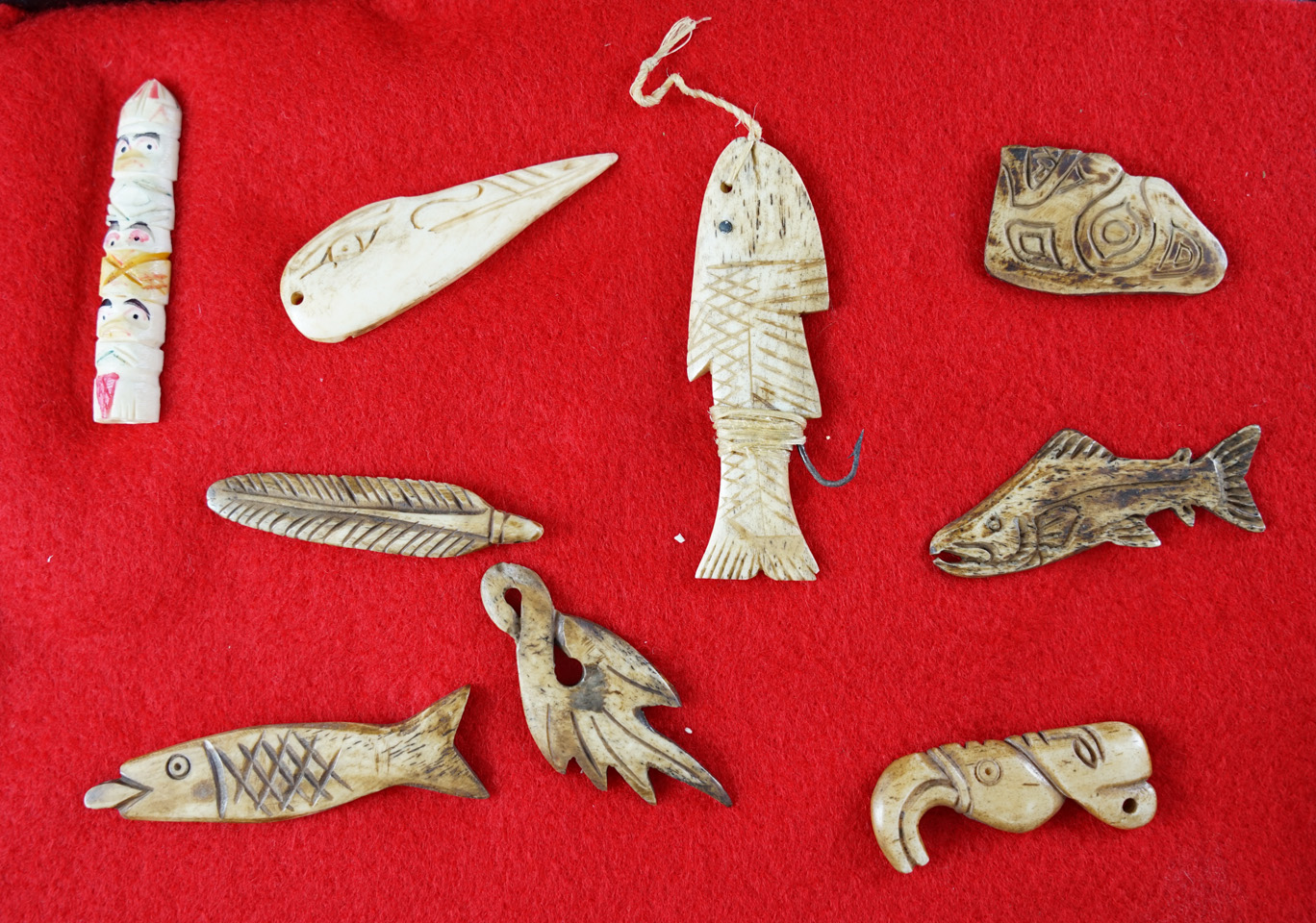 Nice group! Set of nine Inuit ivory carvings including a 2 1/2" fishing lure.