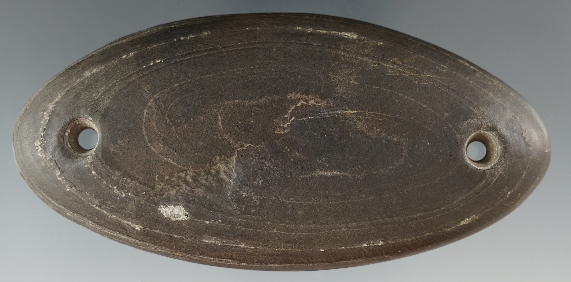 4 3/16" Cannel Coal Oval Gorget with a cup bottom, Scioto Co., Ohio. Ex. Litchfield, Root.