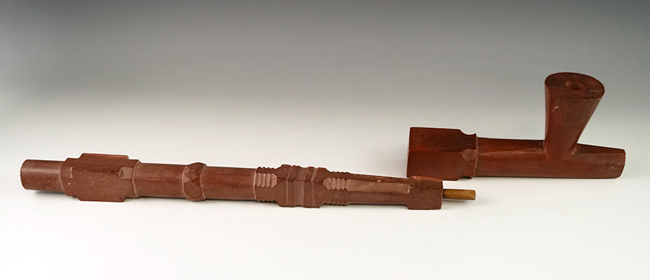 Very large and ornately carved 19 3/4" two-piece Catlinite Pipe and stem.