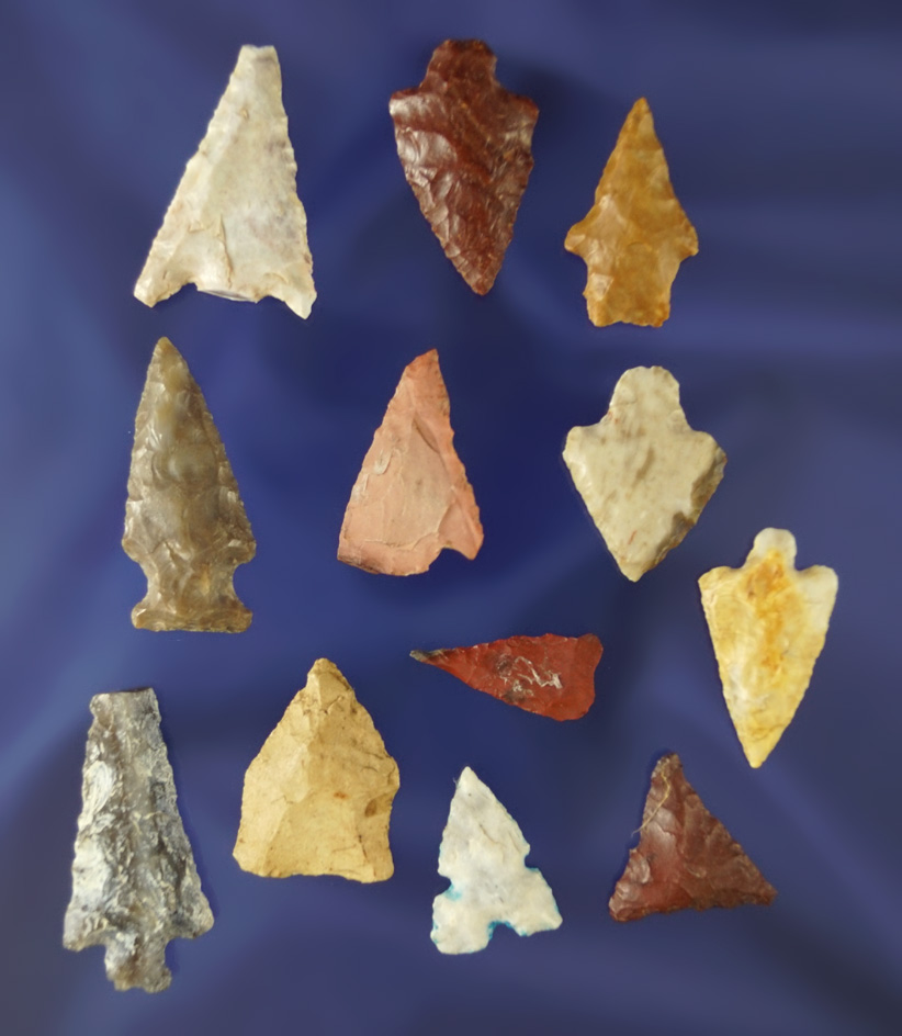 set of 11 assorted arrowheads in various conditions, largest is 1 3/16".