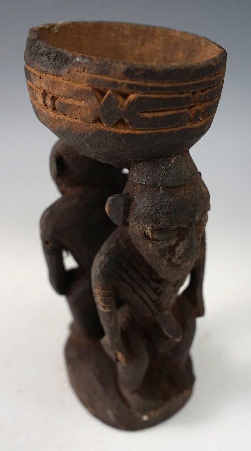 Excellent carving on this 5 3/4" Tall wood dual human effigy bowl from New Guinea.