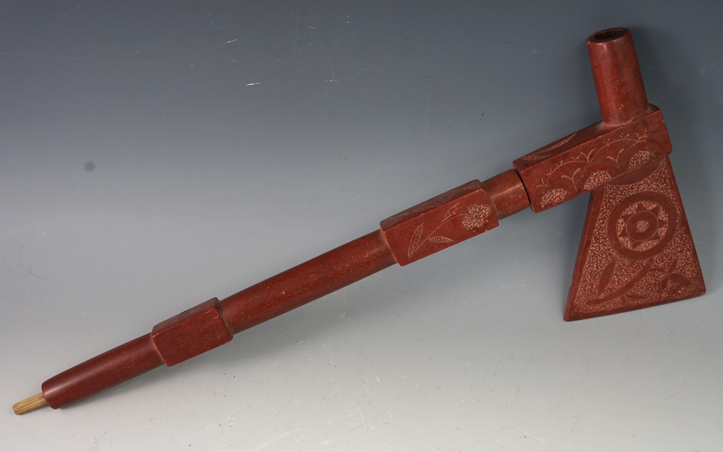 Beautifully crafted 13 5/8" Overall length floral design two piece catlinite tomahawk pipe.