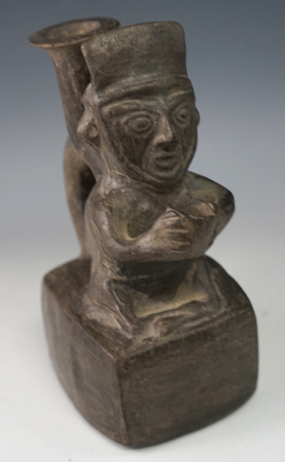 6 5/8" Tall Chimu Culture Blackwear Pottery Vessel featuring a "begger"  motif, found in Peru.