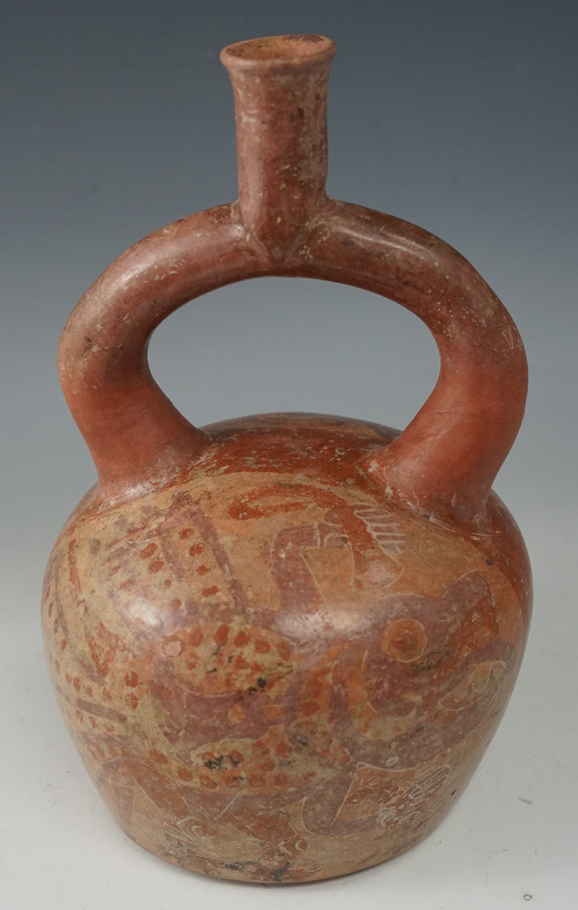 8" Tall Moche II Stirrup Bottle with painted exterior. Stirrup was broken off and restored back.