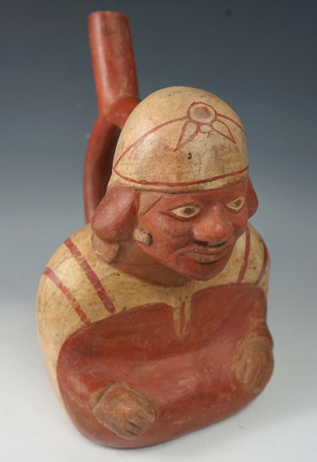 9 3/4" Tall Moche culture Stirrup Bottle featuring a dignitary, found in Peru.