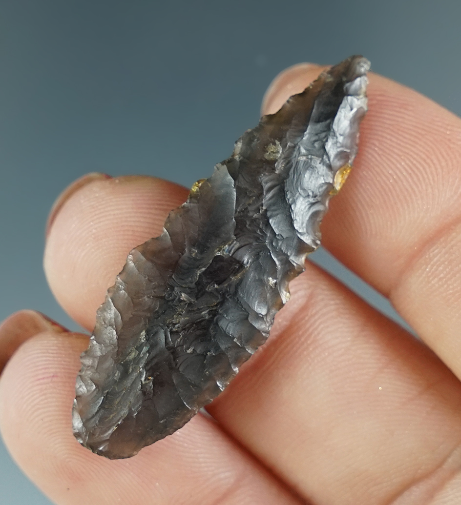 Excellent flaking on this 1 5/8" Cascade made from attractive banded smoke and black Obsidian.