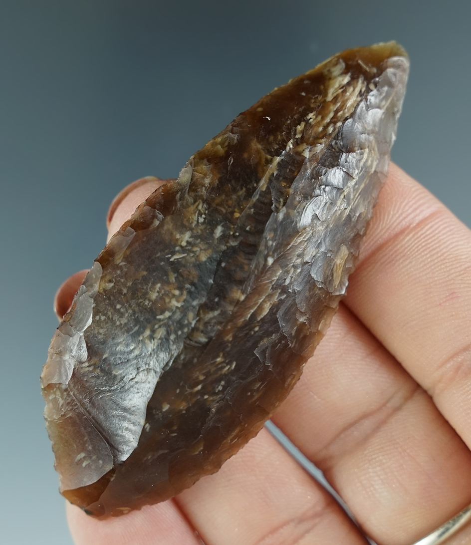 Exceptional flaking on this 2 3/4" Agatized wood Uniface Knife found in Washington.