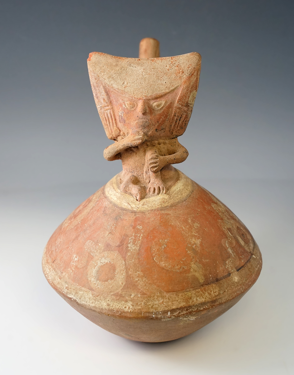 8" Tall Pre-Columbian Stirrup Bottle with nice paint and figure, found in Peru.