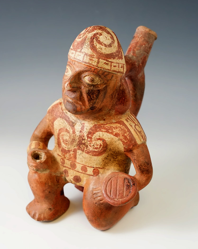 7" Tall Moche Kneeling Warrior Stirrup Bottle with nice paint, found in Peru.