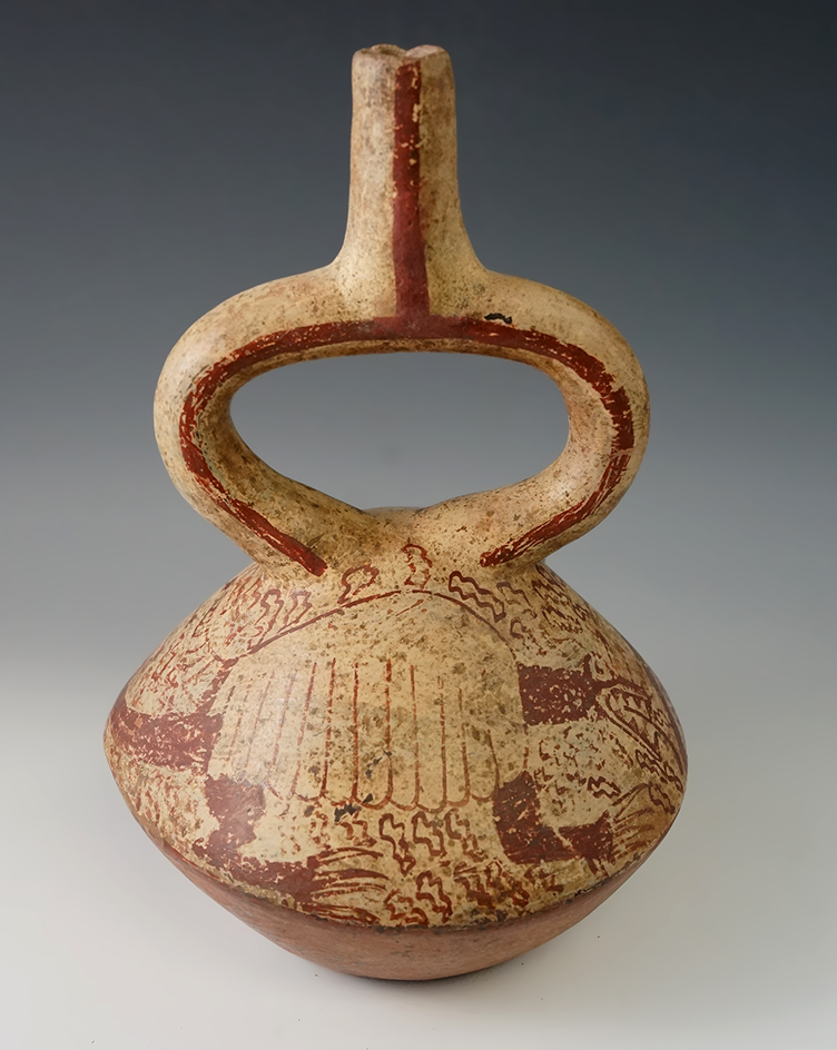 9 1/4" Tall Moche Stirrup Bottle that is nicely decorated, found in Peru.