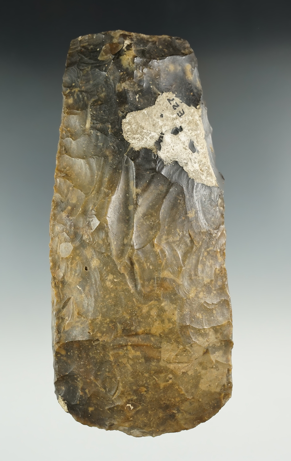 Very heavily patinated 5 3/4" Flint Celt with nice lace-work edges. Found in Sweden.