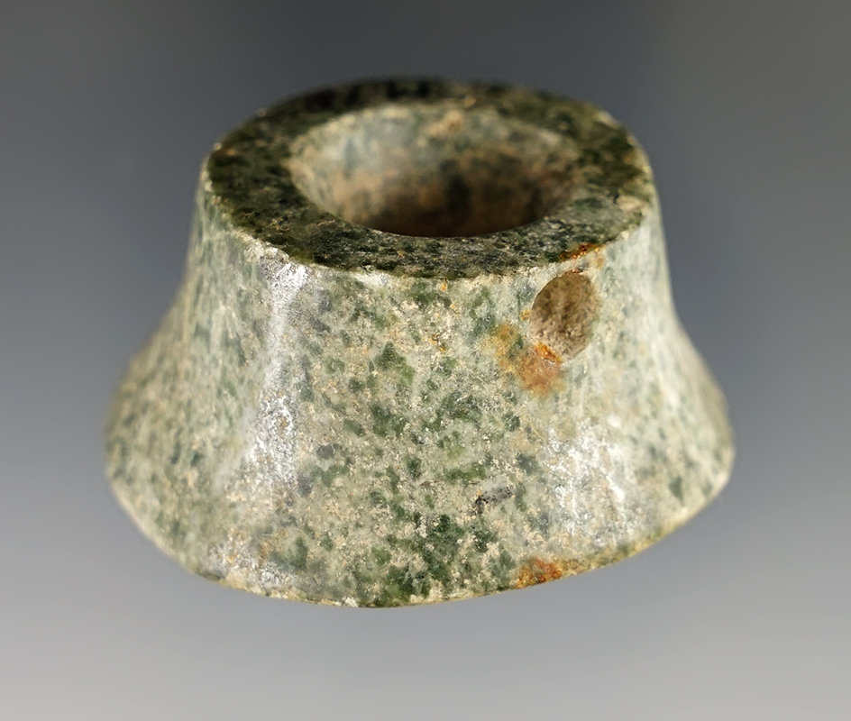 1 3/4" diameter Pre-Columbian ear spool made from attractive material. Found in Mesoamerica.