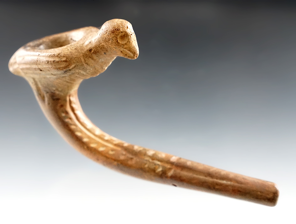 5 1/4" long Eagle or Hawk effigy Iroquois clay pipe with partial restoration to stem area.