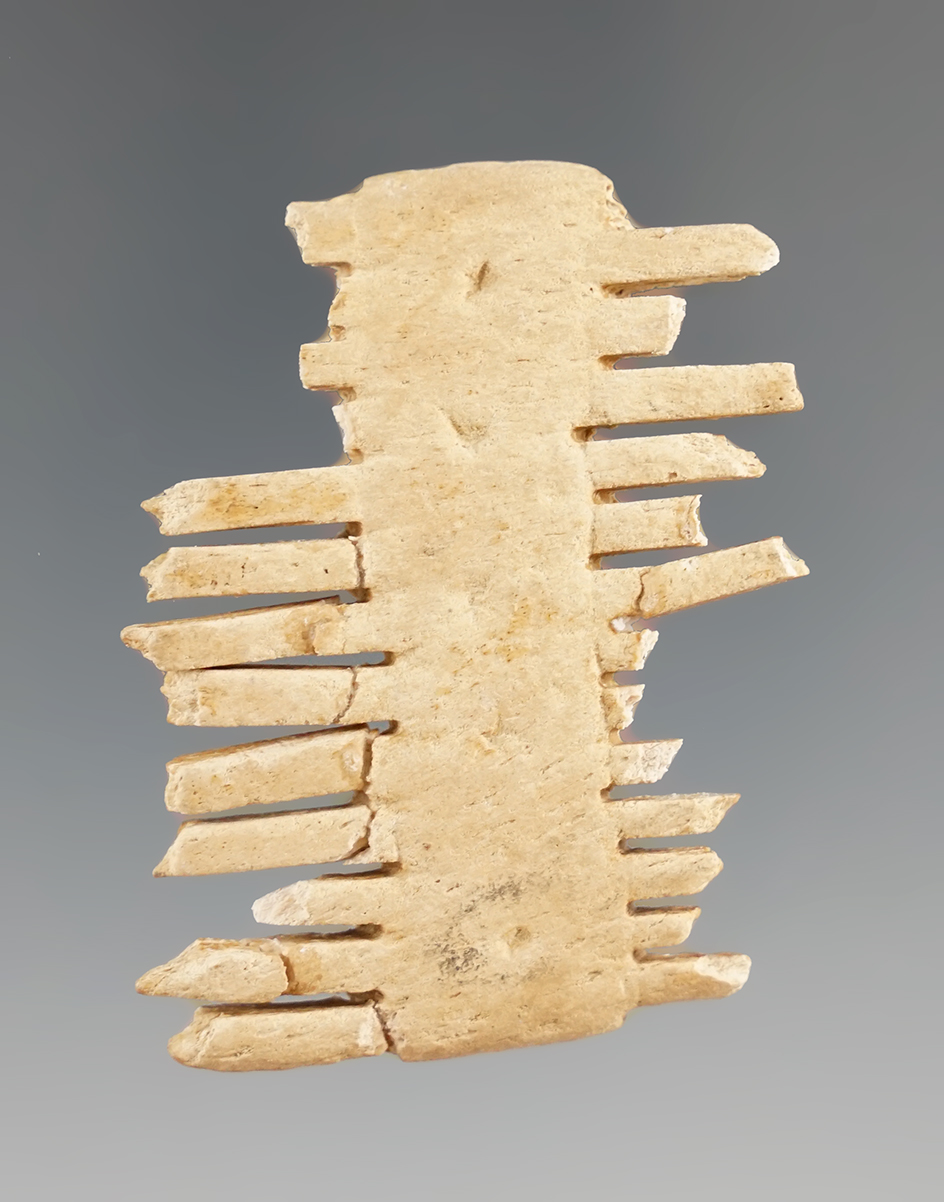 2 1/8" Seneca bone comb found in New York. A few tines have been reglued.