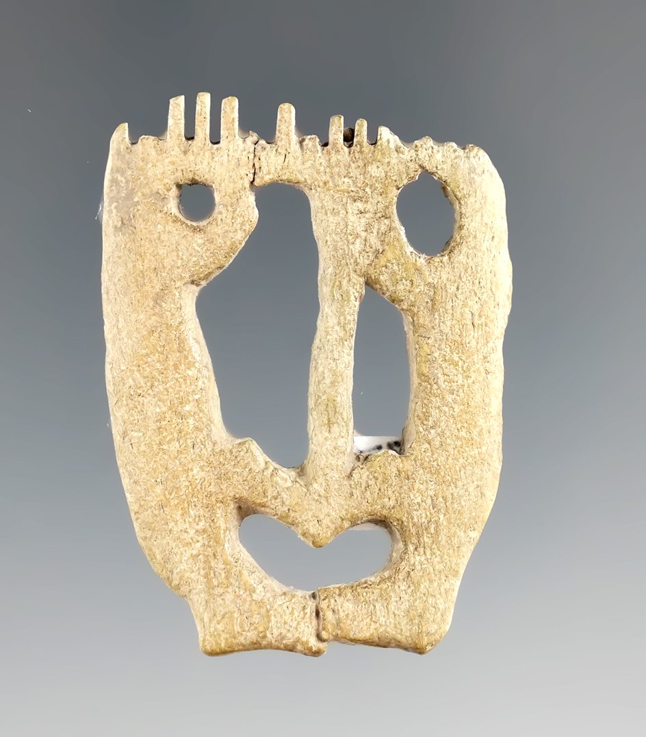 1 7/8" dual Bear effigy bone comb found in New York.