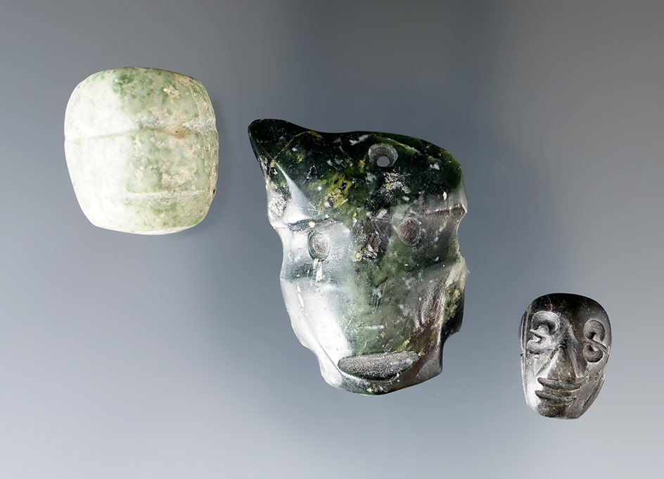Set of 3 Pre-Columbian Drilled Pendants that are carved into a face. The largest is 1 9/16".