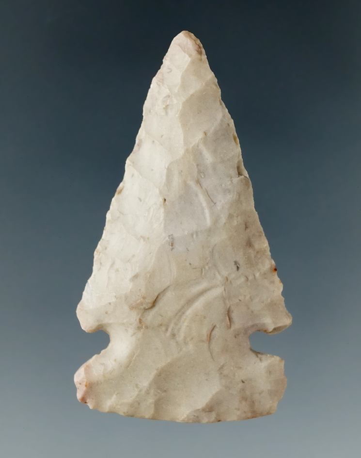 Nicely flaked 1 13/16" sidenotch archaic dart point with a nicely ground base found in Illinois.
