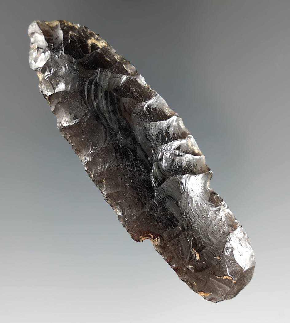 3 3/16" Lind Coulee made from Obsidian, found in Oregon. Pictured in Overstreet. Ex. Jim Hogue.